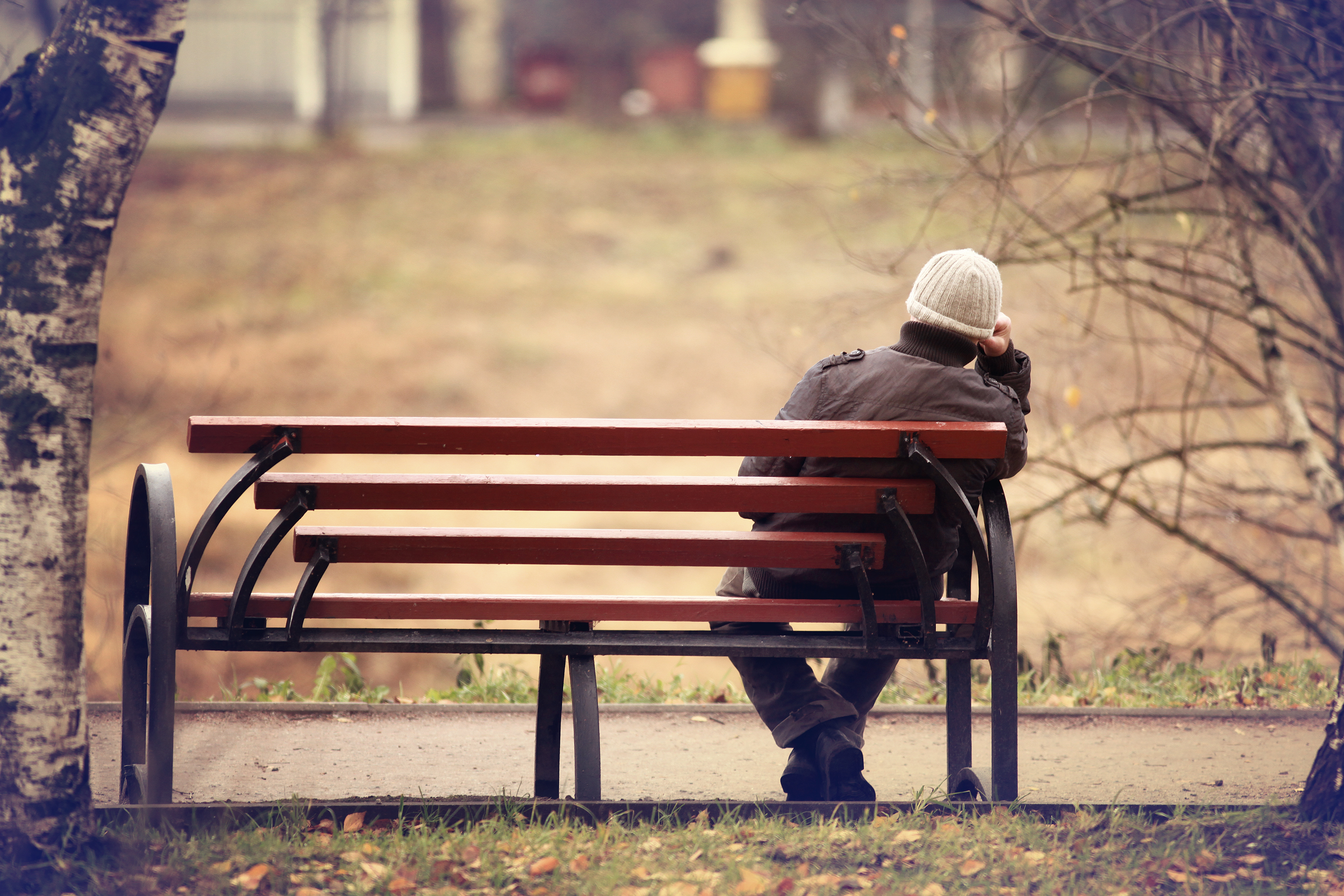 lonely man on the bench in autumn